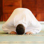 A-Muslim-man-praying-wearing-white-clothes